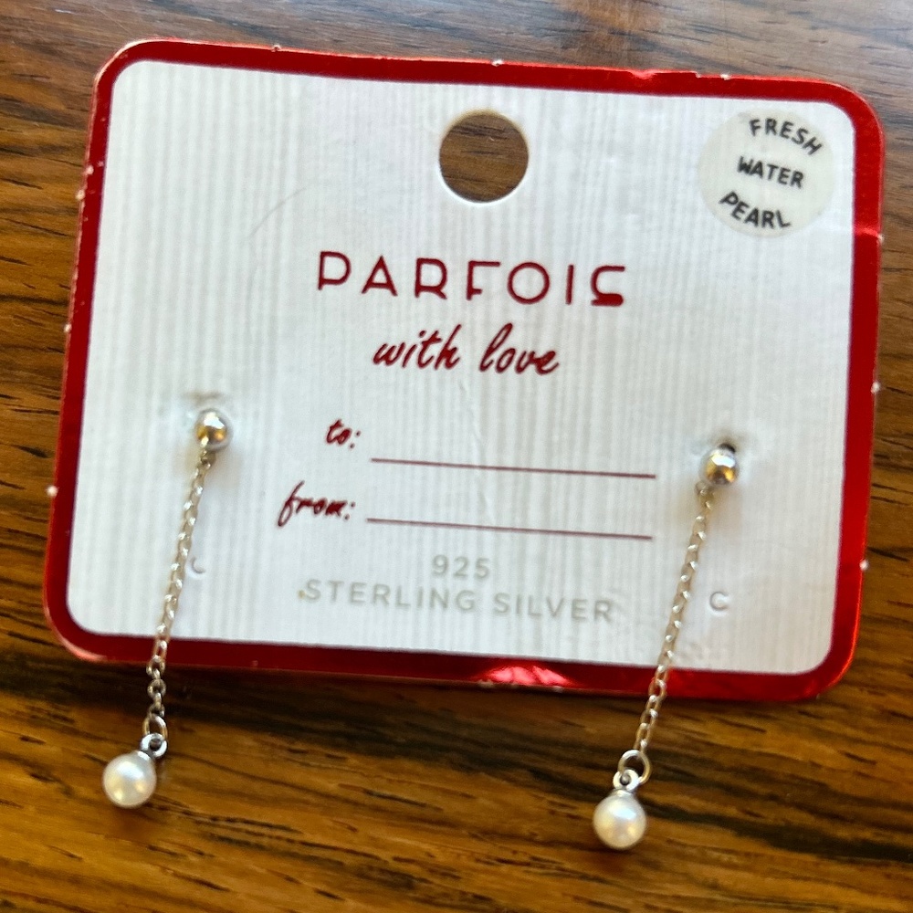 Sterling silver and fresh water pearl dangling earrings.